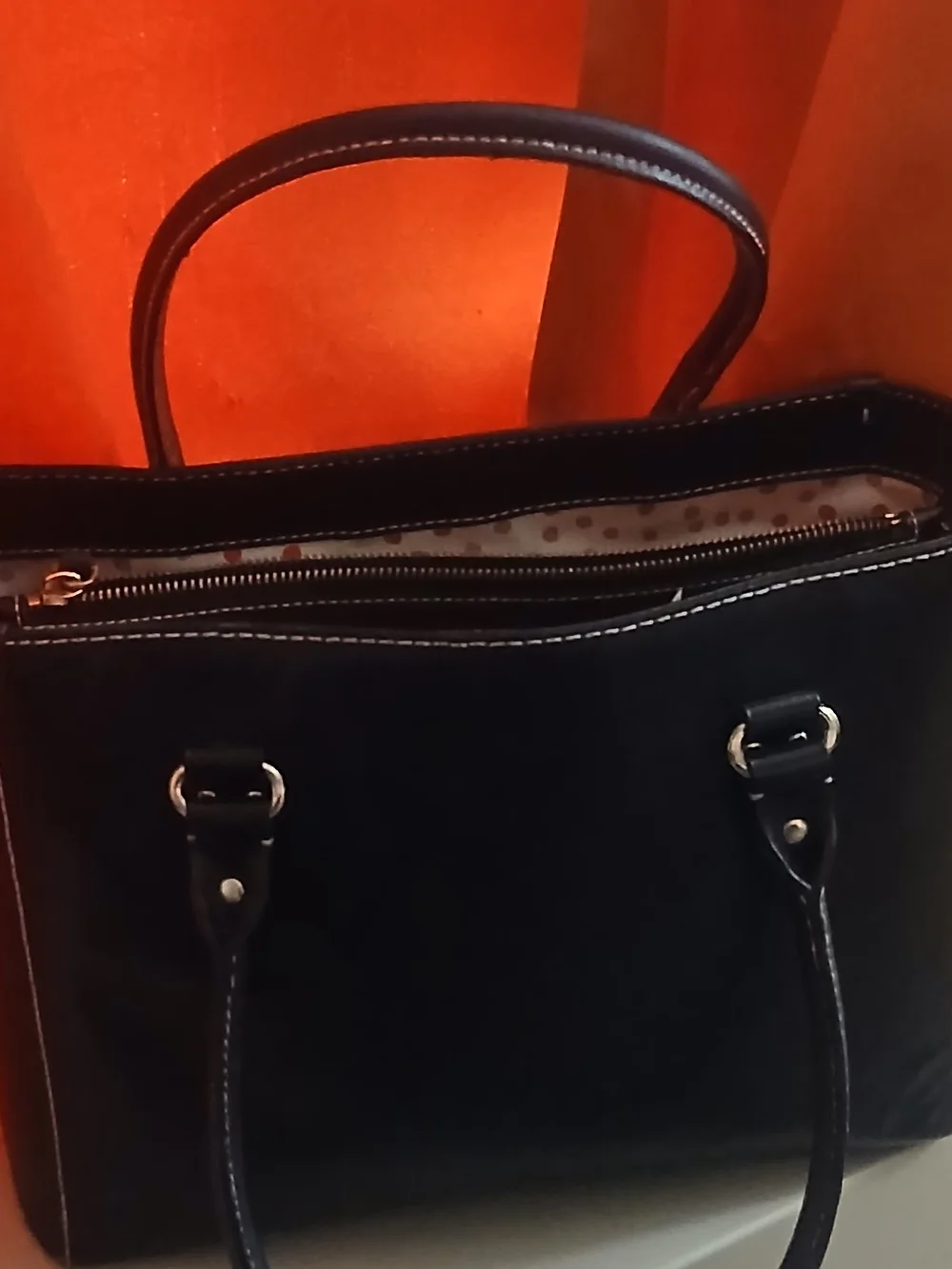 kate spade black leather satchel with polka-dot interior
